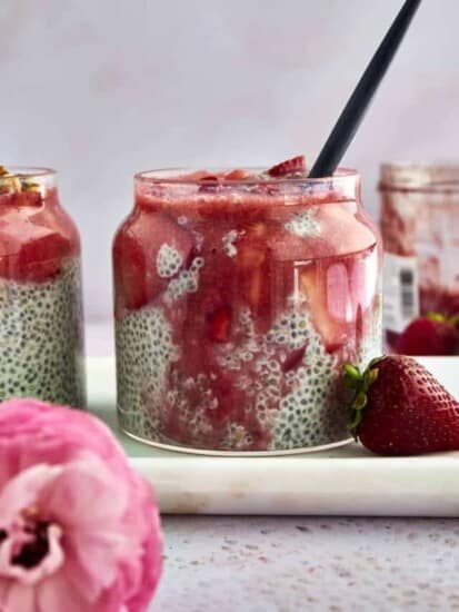 A jar of strawberry chia pudding topped with strawberry purée.