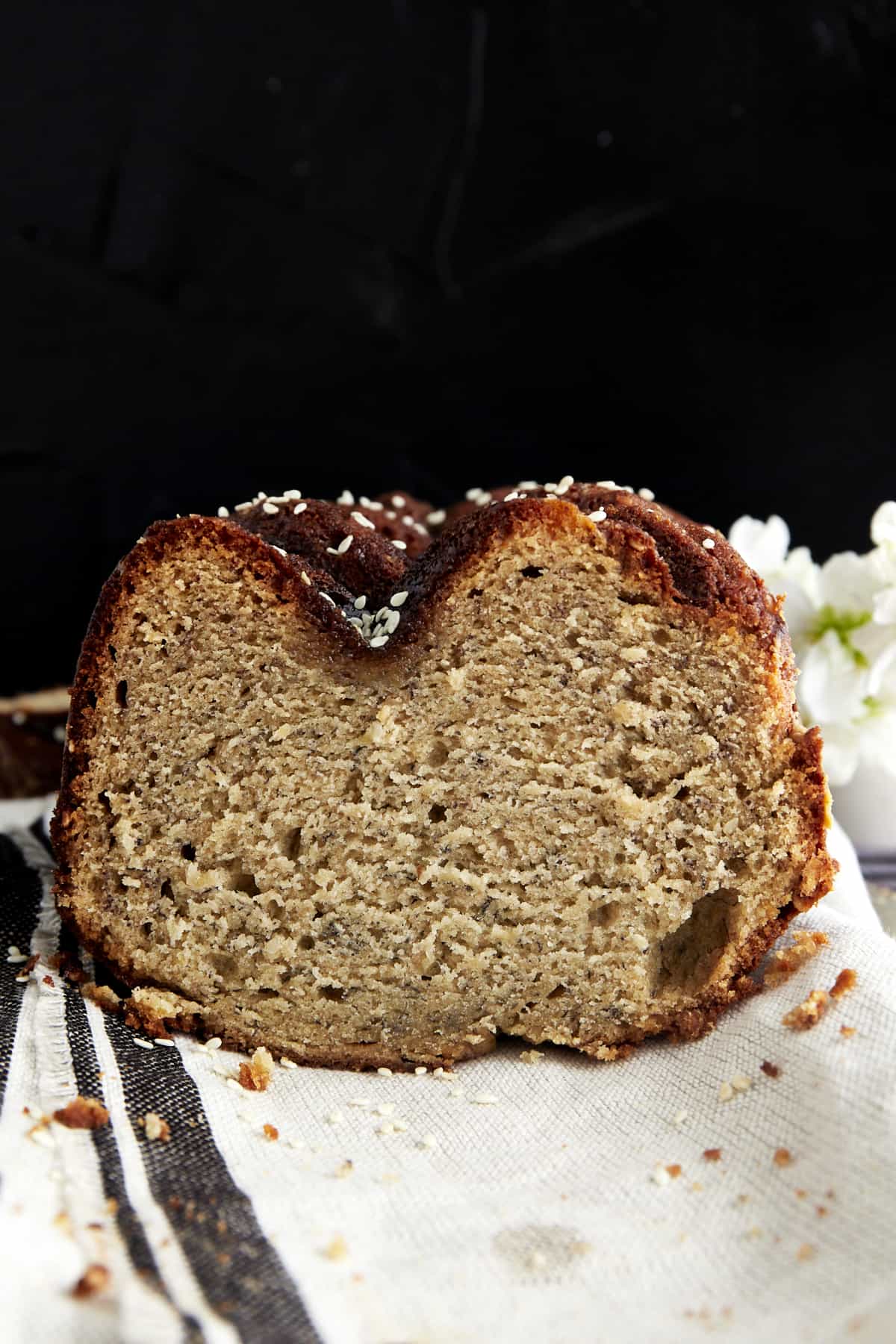 Front view of a sliced loaf of tahini banana bread. 