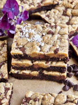 A stack of 3 brookie bars topped with sea salt flakes.
