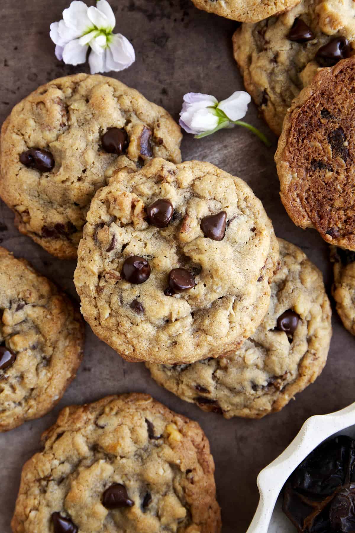 Overhead image of chewy date cookies with chocolate chips and walnuts.