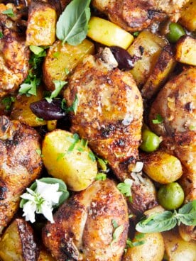 Baked chicken drumsticks with potatoes.