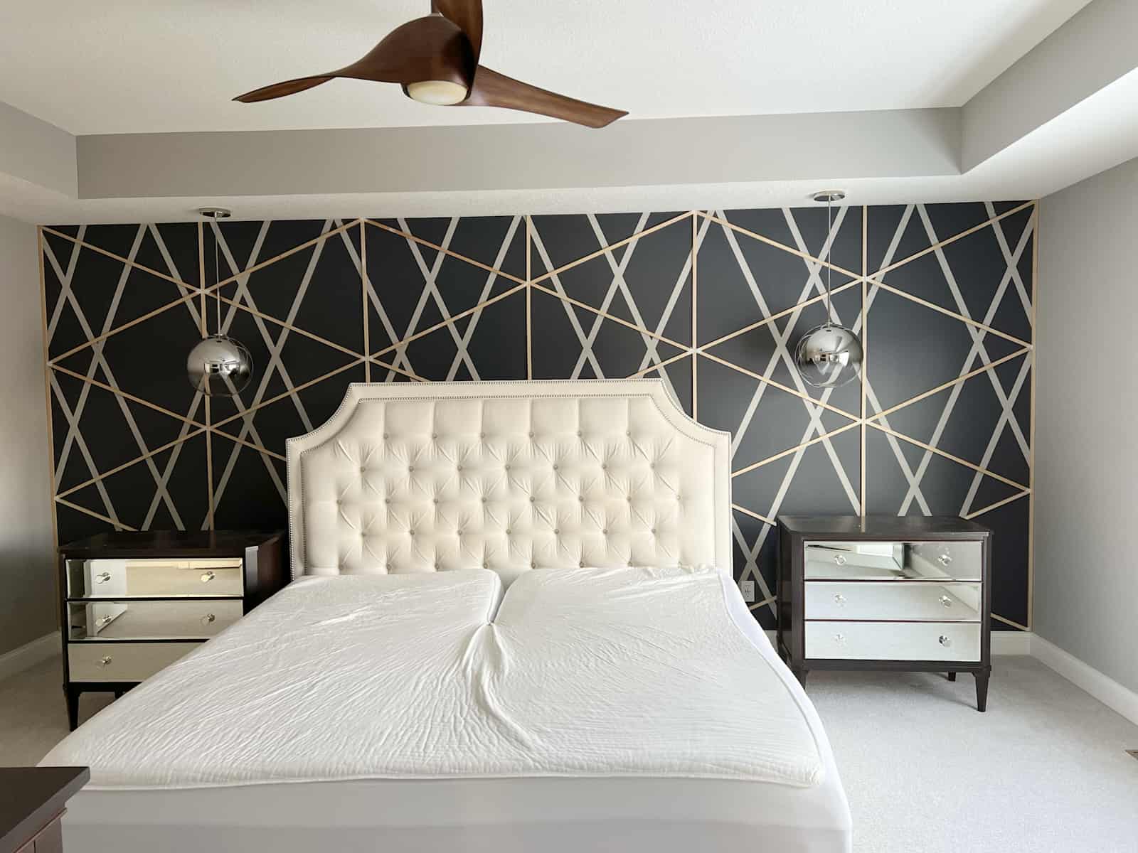 An accent wall with geometrical shapes. 