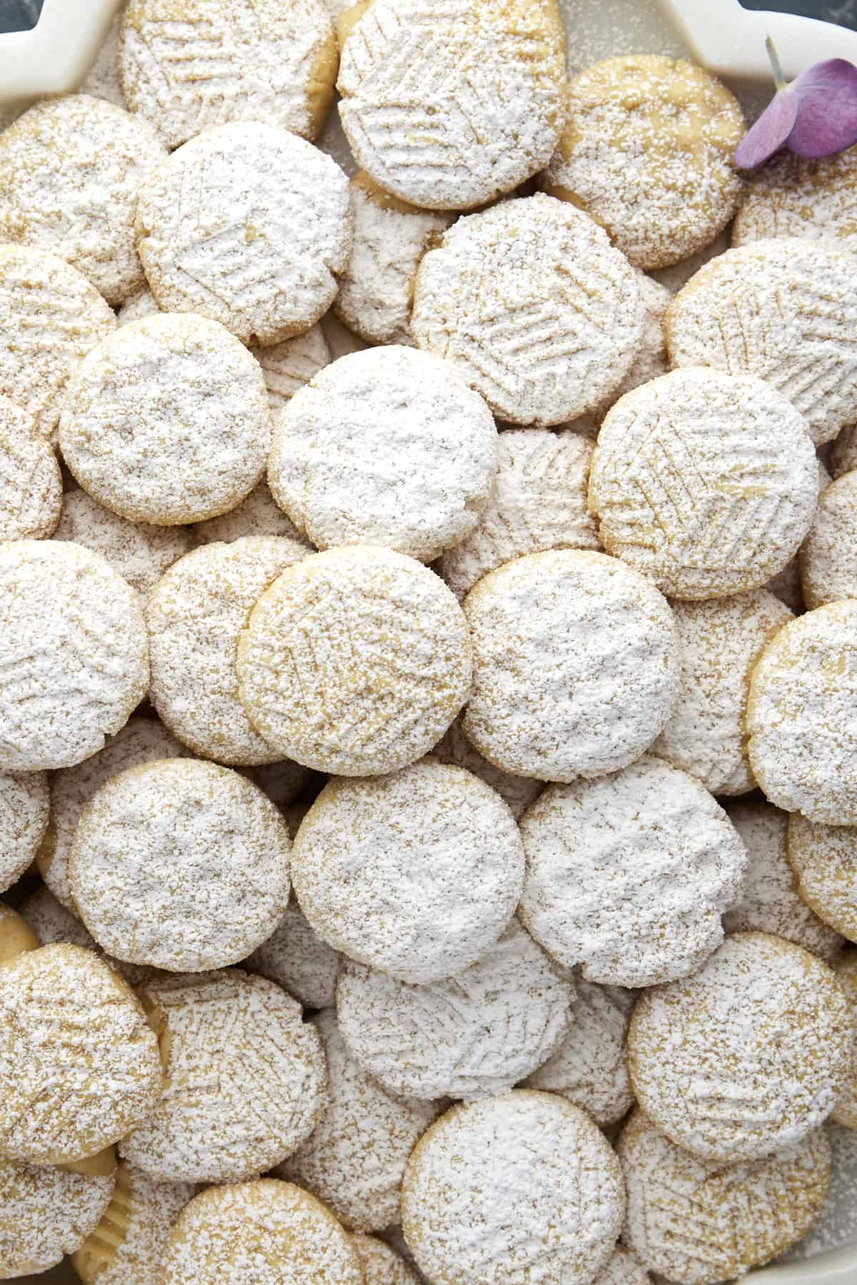 Close up image of Eid Cookies topped with powdered sugar. 