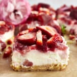 Side view of a strawberry cheesecake bar.