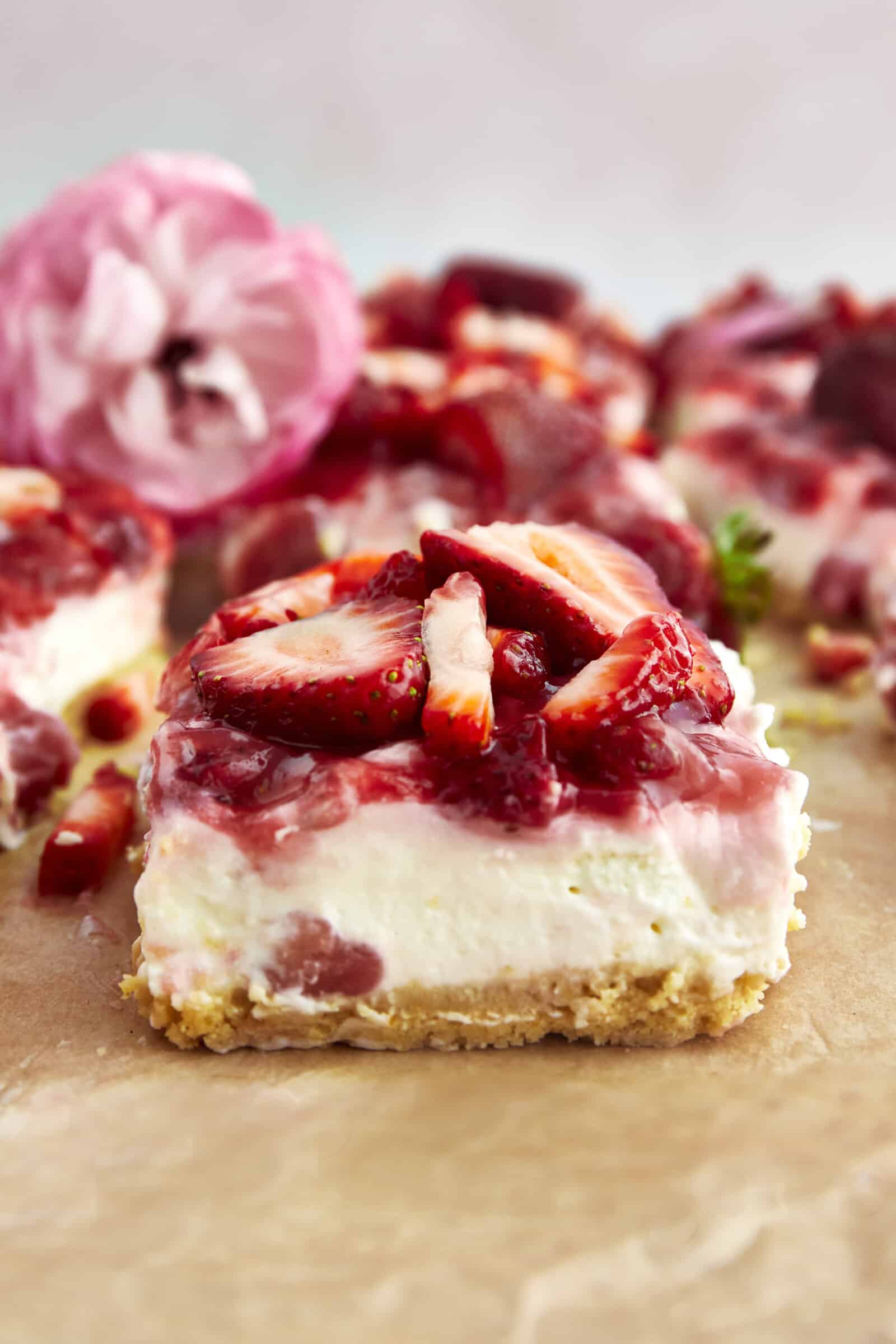 Side view of a strawberry cheesecake bar.