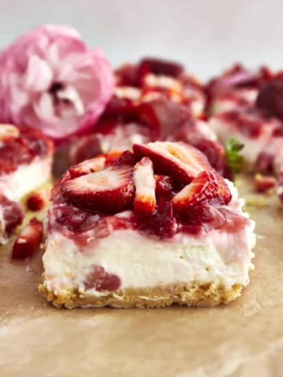 Side view of a strawberry cheesecake bar.