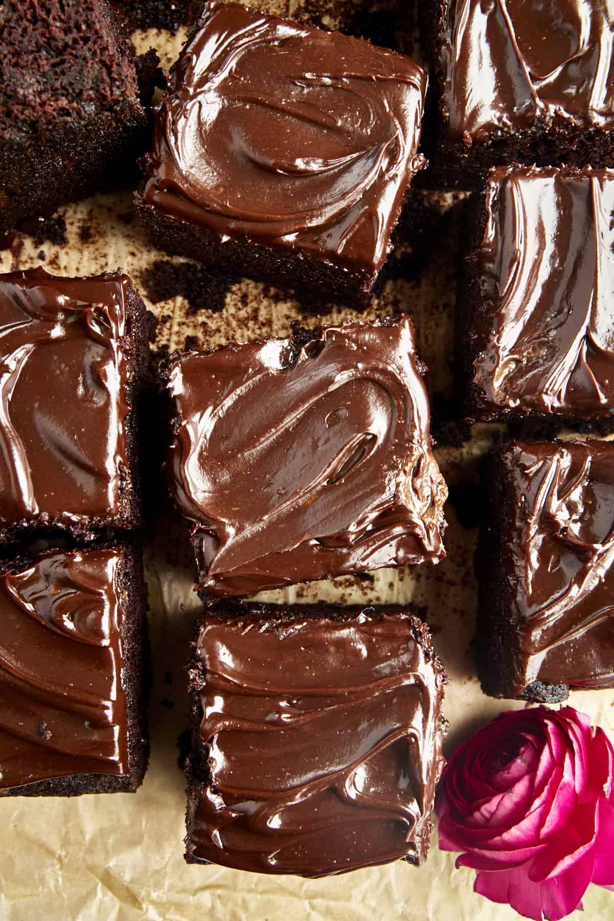 Squares of chocolate frosted chocolate zucchini cake. 