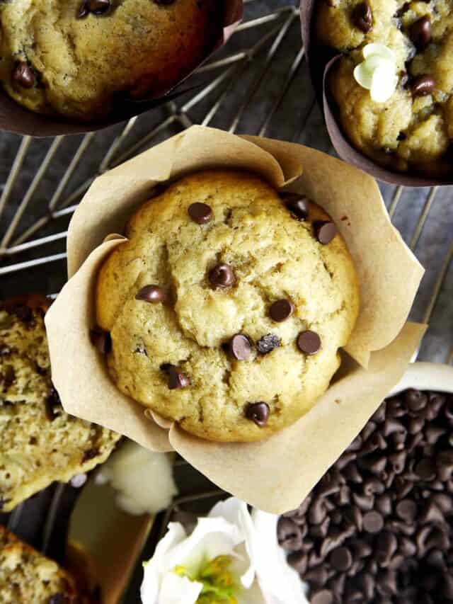 Overhead image of an easy chocolate chip banana bread muffin in a paper liner.