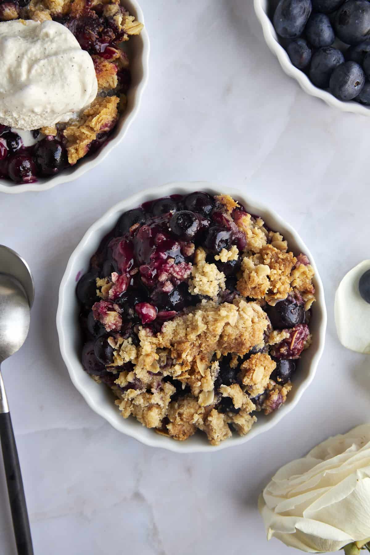 Overhead image of a ramekin of blueberry crisp. 