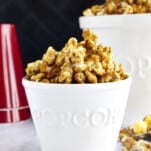 A small bowl full of caramel popcorn.