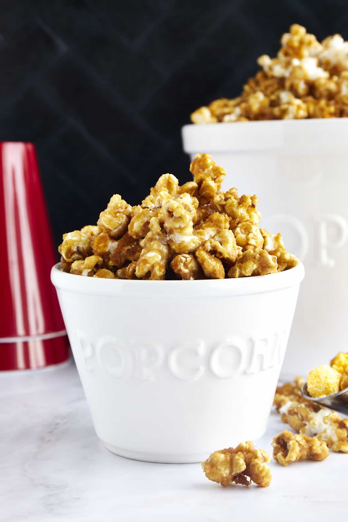 A popcorn bucket full of homemade caramel popcorn. 