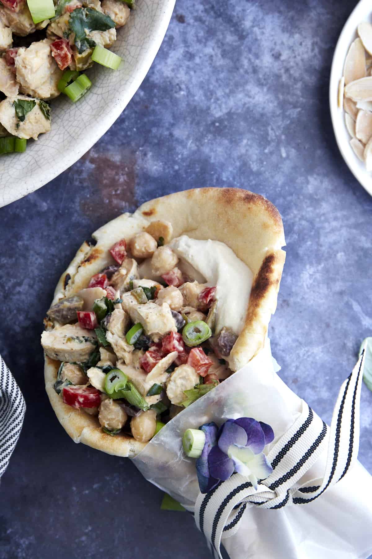 A pita wrap filled with chickpea chicken salad. 