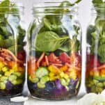 Three rainbow salad jars.