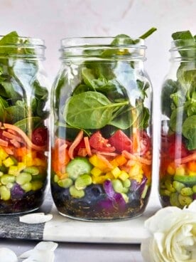 Three rainbow salad jars.