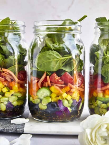 Three rainbow salad jars.