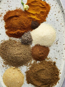 Piles of spices on a platter to make shawarma spice.