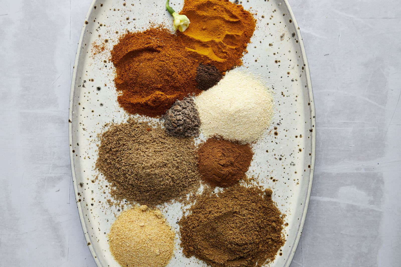Piles of spices on a platter to make shawarma spice.