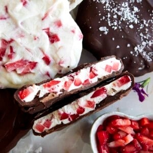 A chocolate strawberry yogurt cluster split in half showing the yogurt center.