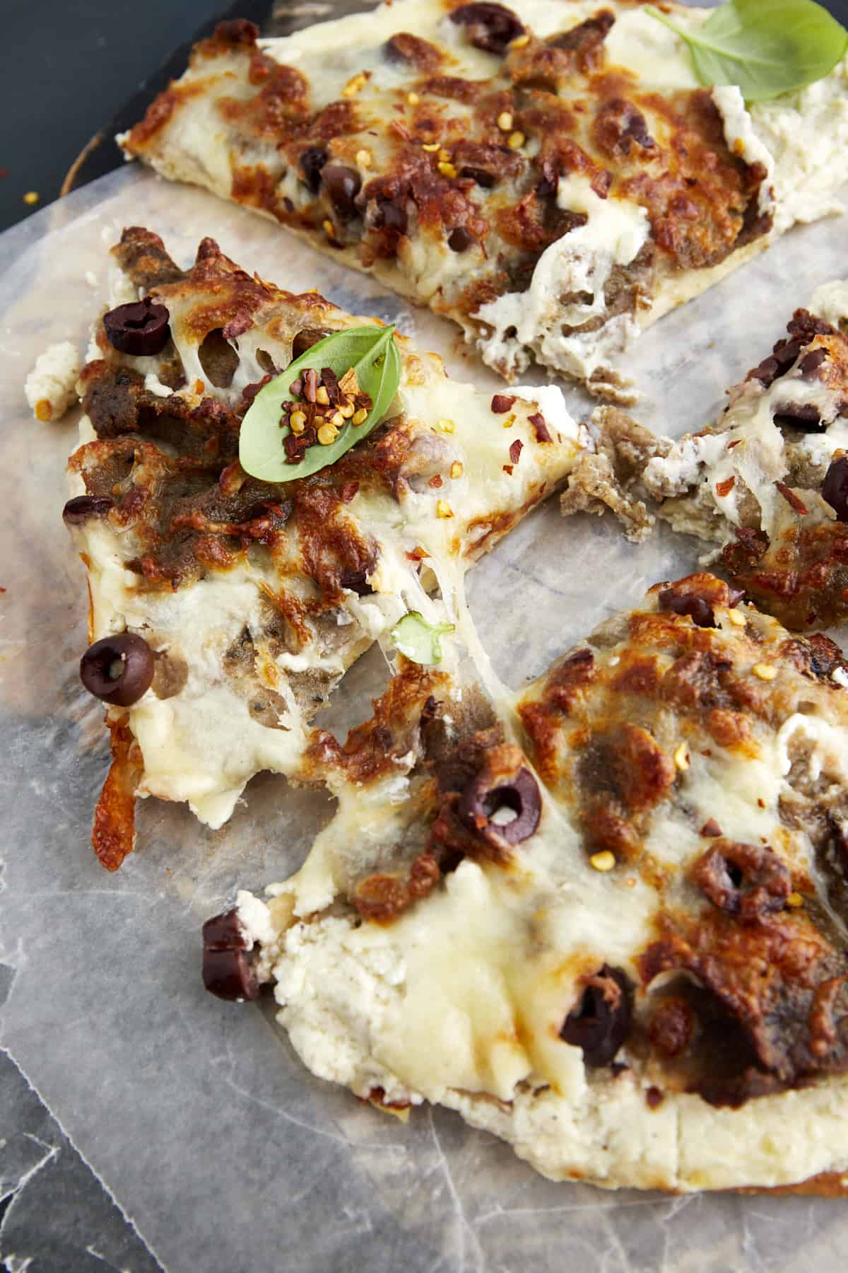 Sliced feta gyro pizza.