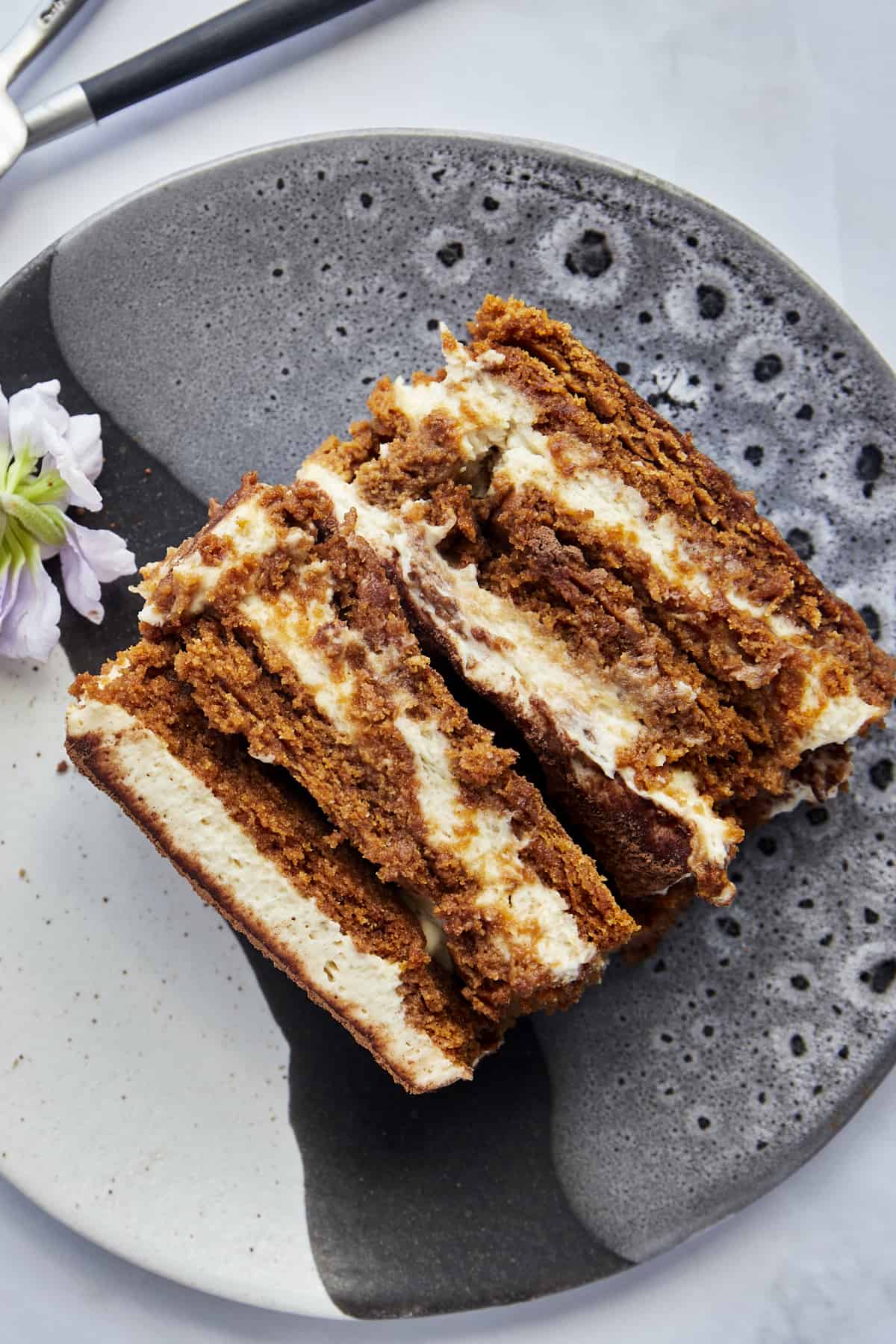 Overhead image of layered Biscoff tiramisu on a plate.