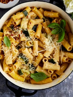 Overhead image of a pot of pasta with zucchini.