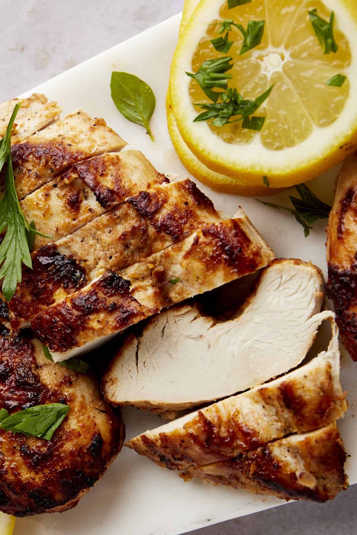 Overhead image of sliced Greek lemon chicken. 