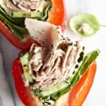 Two halves of a sliced low-carb turkey bell pepper sandwich.
