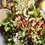 A platte of Middle Eastern Cobb Salad with dressing on the side.