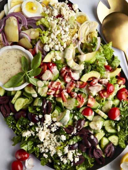 A platte of Middle Eastern Cobb Salad with dressing on the side.