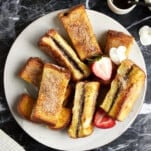 Cinnamon sugar Nutella French toast sticks on a plate.