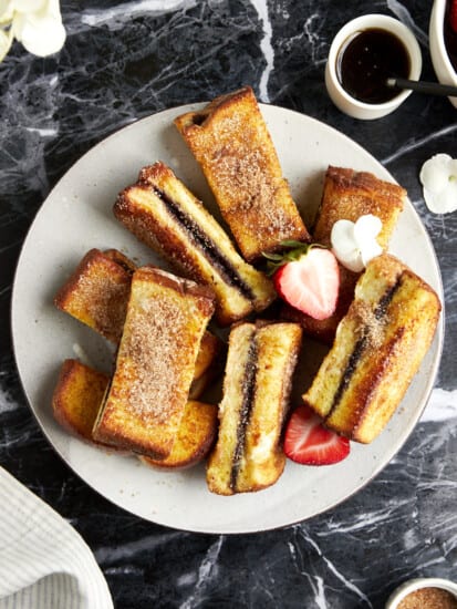 Cinnamon sugar Nutella French toast sticks on a plate.