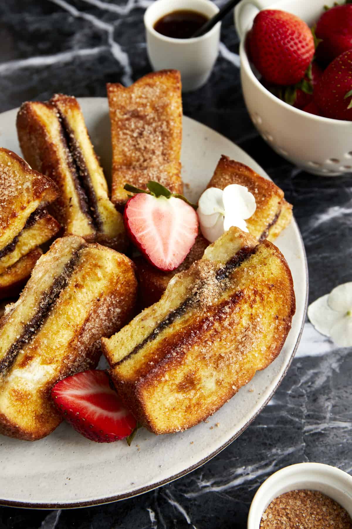 Cinnamon sugar Nutella French toast sticks on a plate. 