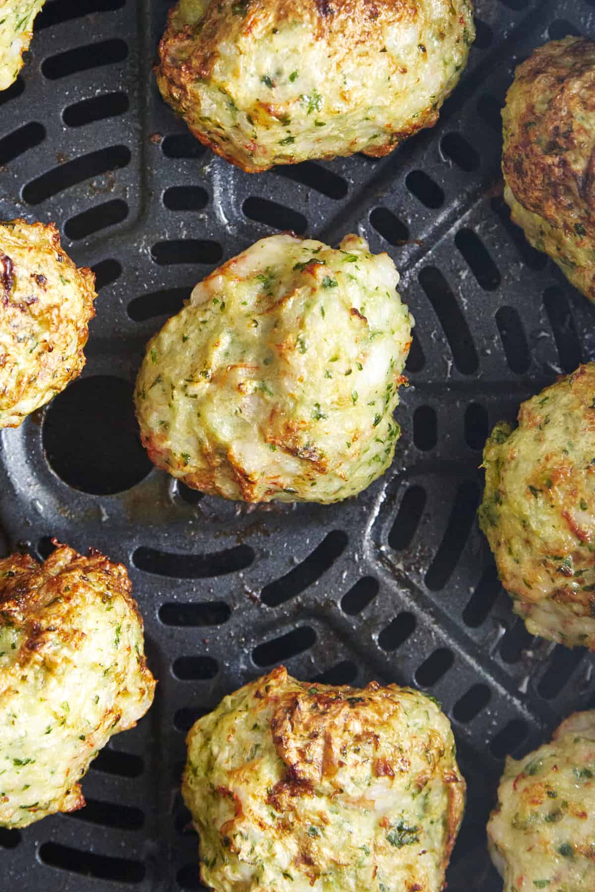 Cooked shrimp kofta meatballs in an air fryer.
