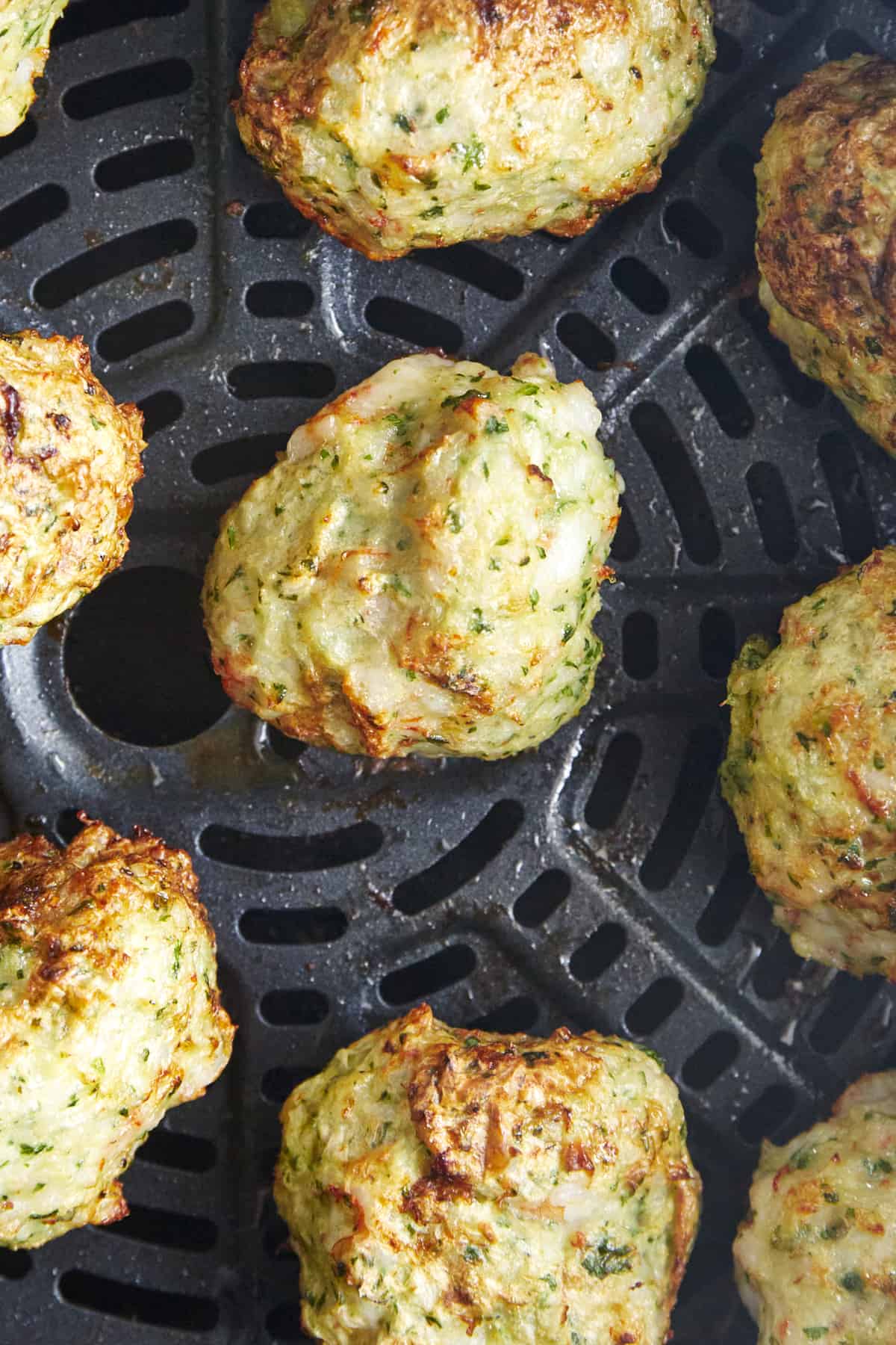 Cooked shrimp kofta meatballs in an air fryer. 