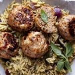 Sun-dried tomato chicken meatballs over rice.