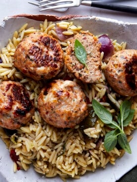 Sun-dried tomato chicken meatballs over rice.