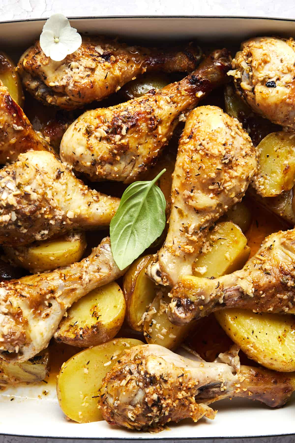 Baked garlic parmesan chicken drumsticks and potatoes. 