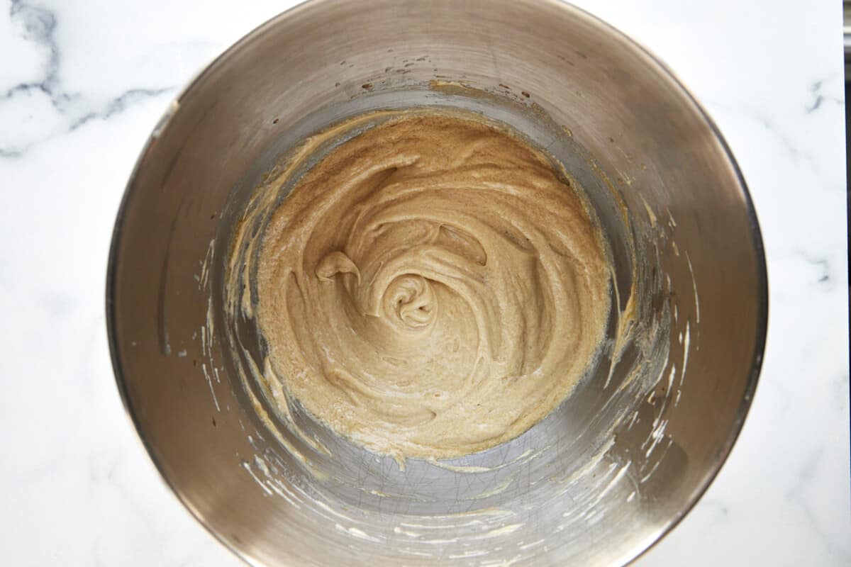 Combined wet ingredients for apple cider donuts in a bowl. 