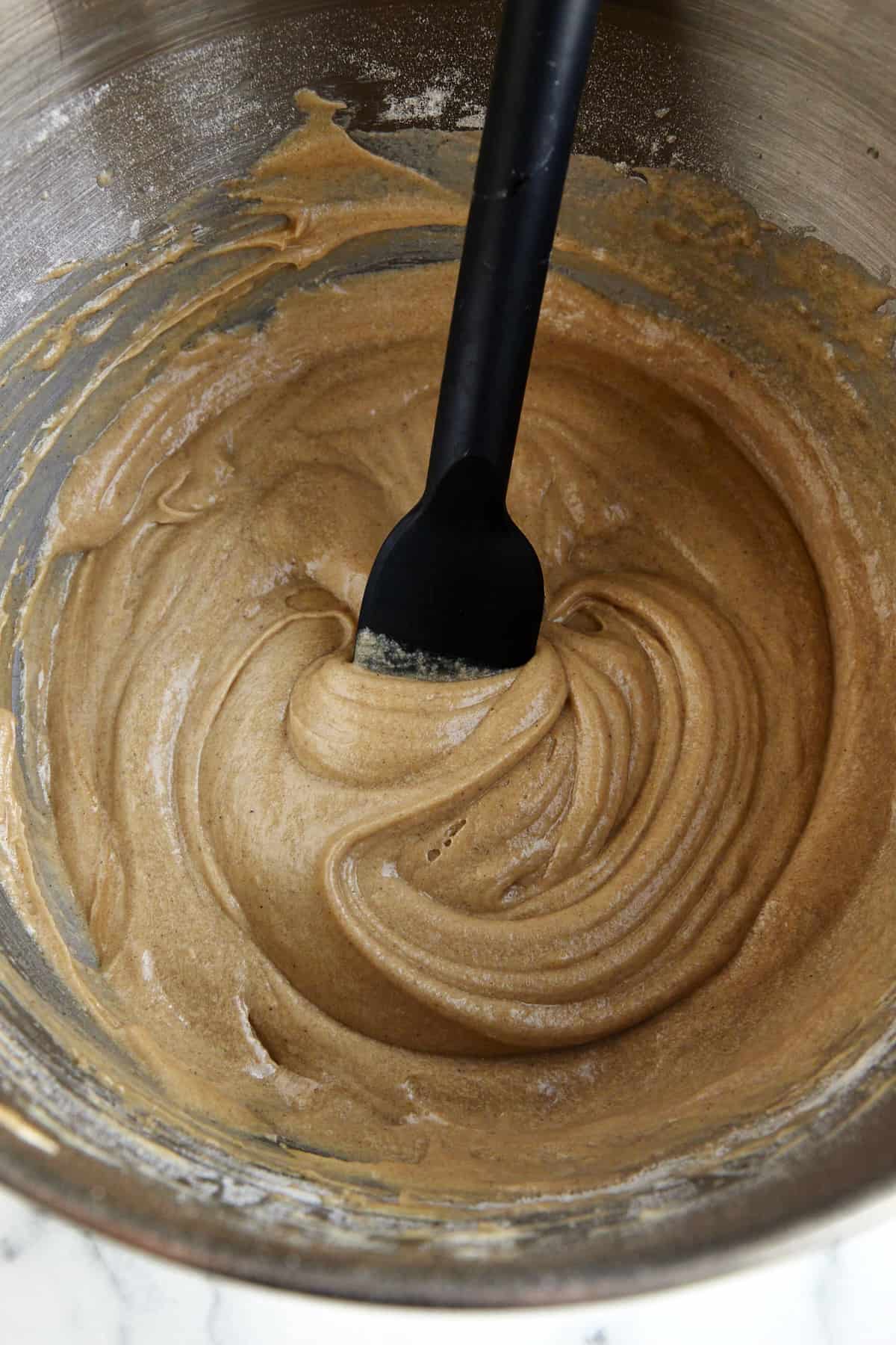 Apple cider muffin batter in a bowl. 