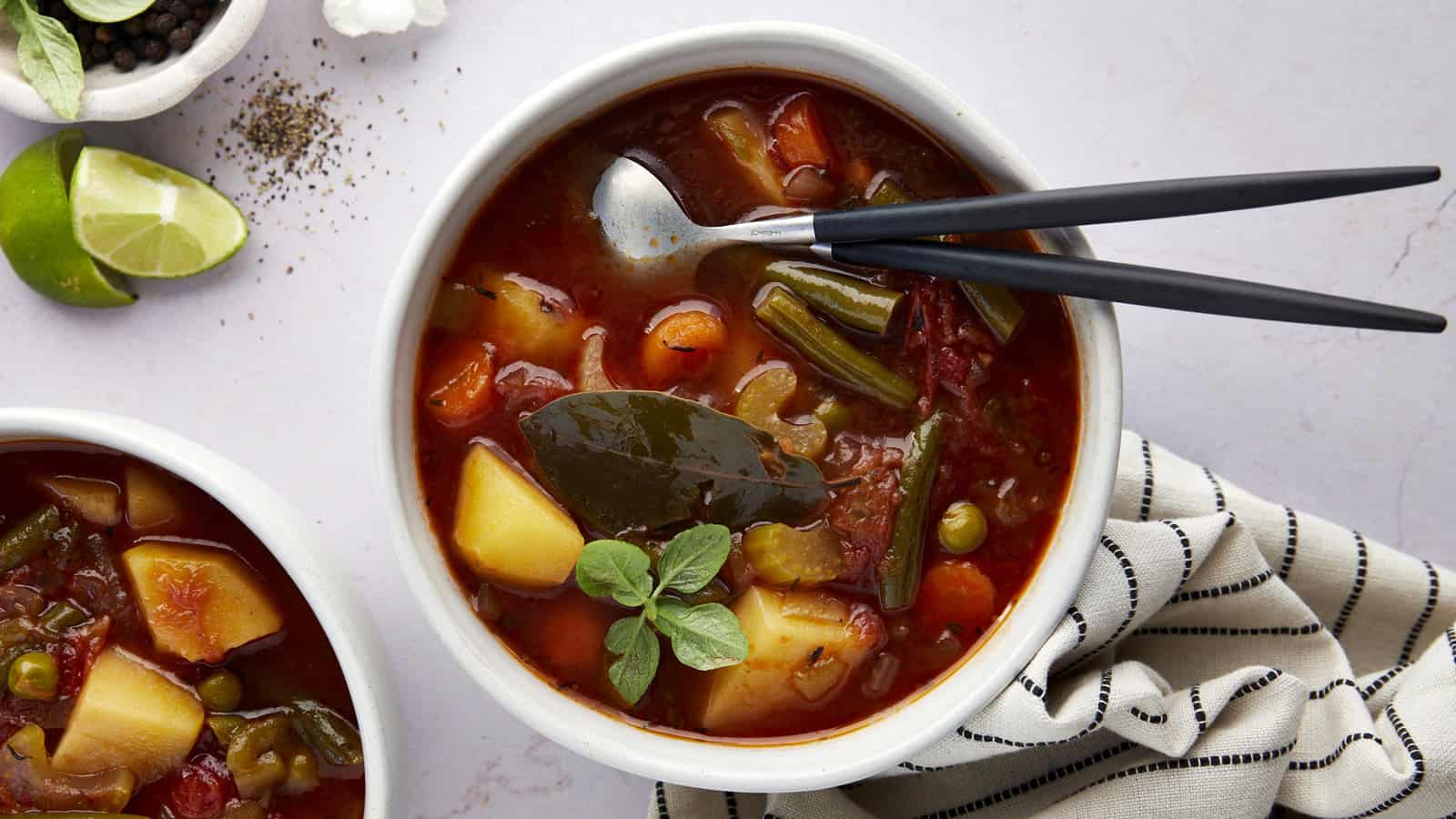 A bowl of slow cooker vegetable soup with vegetables.