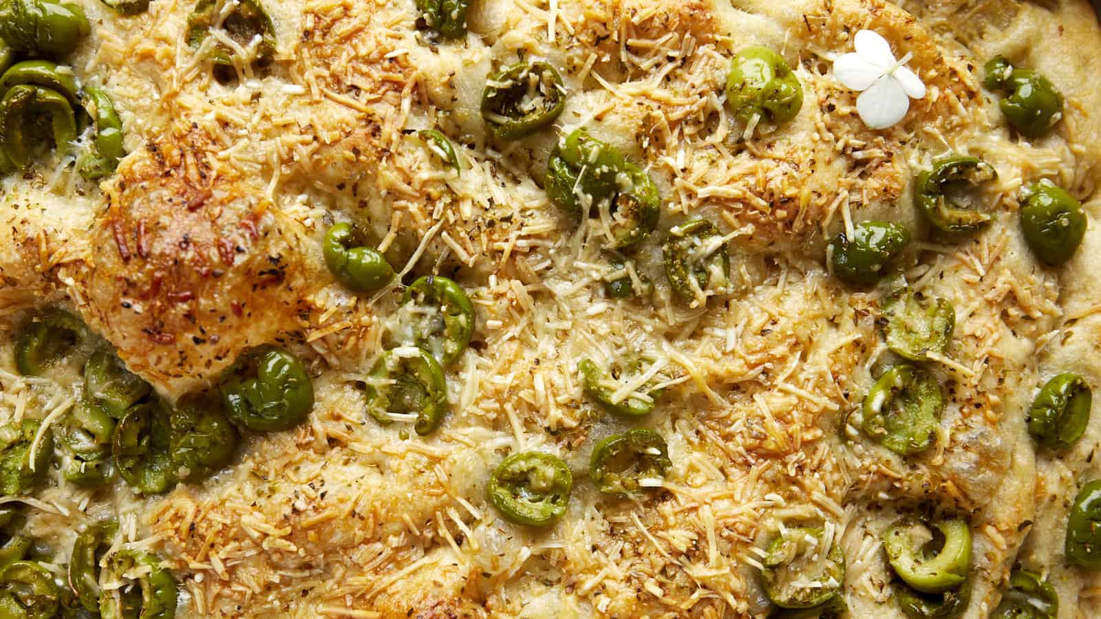 Close up image of olive focaccia bread.
