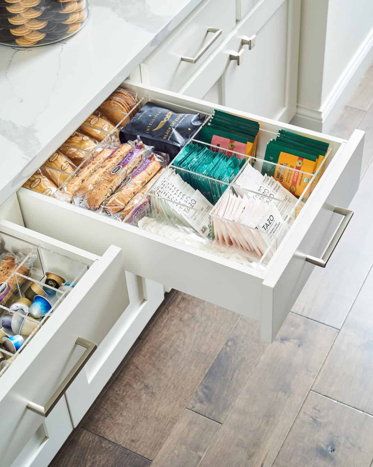 open drawer with tea, coffee, biscotti, and cookies.