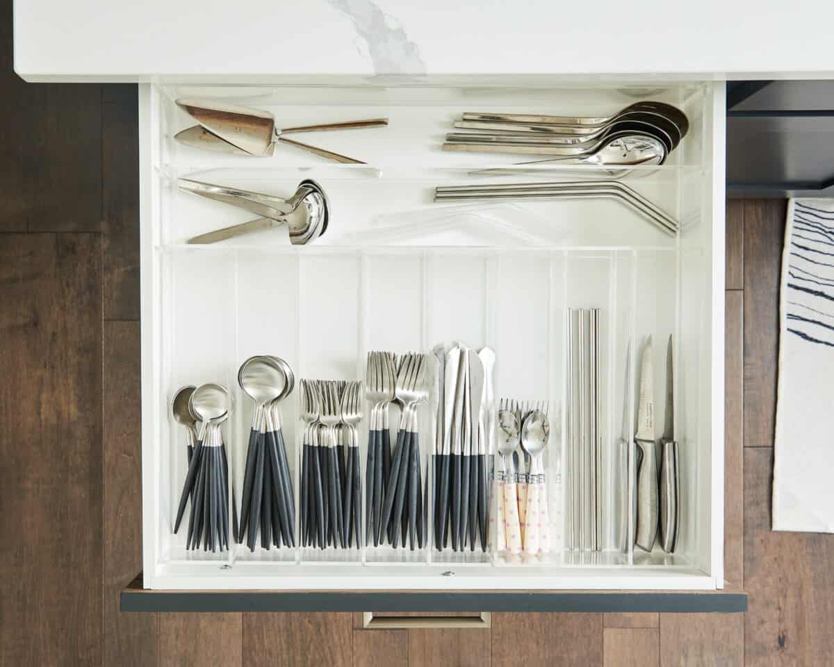 top view of open drawer with utensils in it.