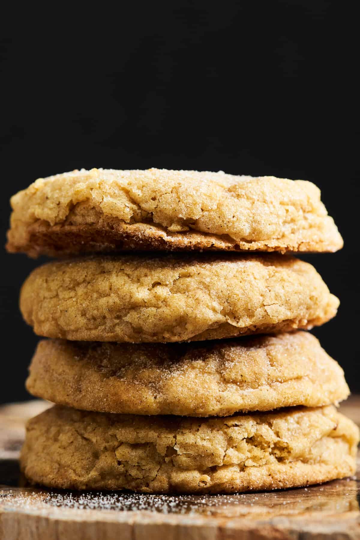 Four soft pumpkin cookies stacked on top of each other. 