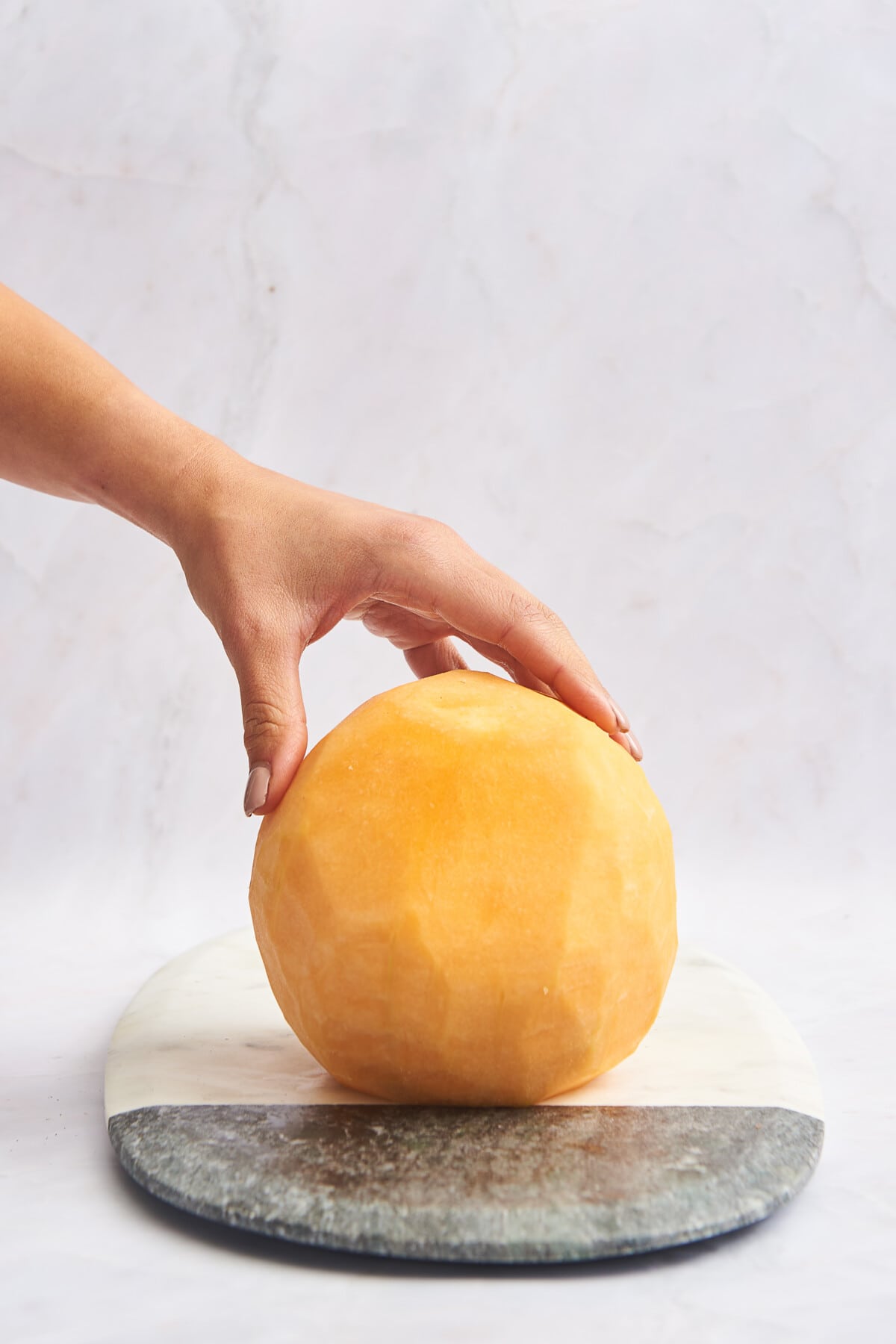 A peeled cantaloupe. 