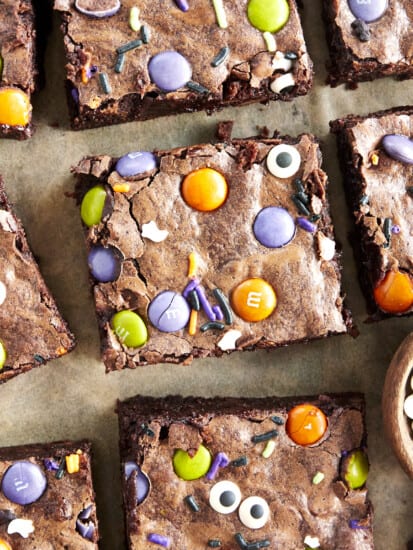 Square Halloween brownies with M&Ms, sprinkles, and eyeballs.