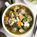 Overhead image of a bowl of Italian wedding soup.
