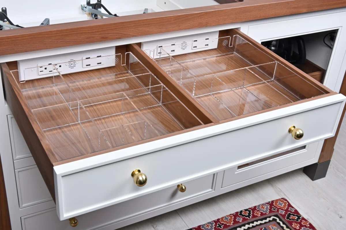 empty drawer with organizers in it.