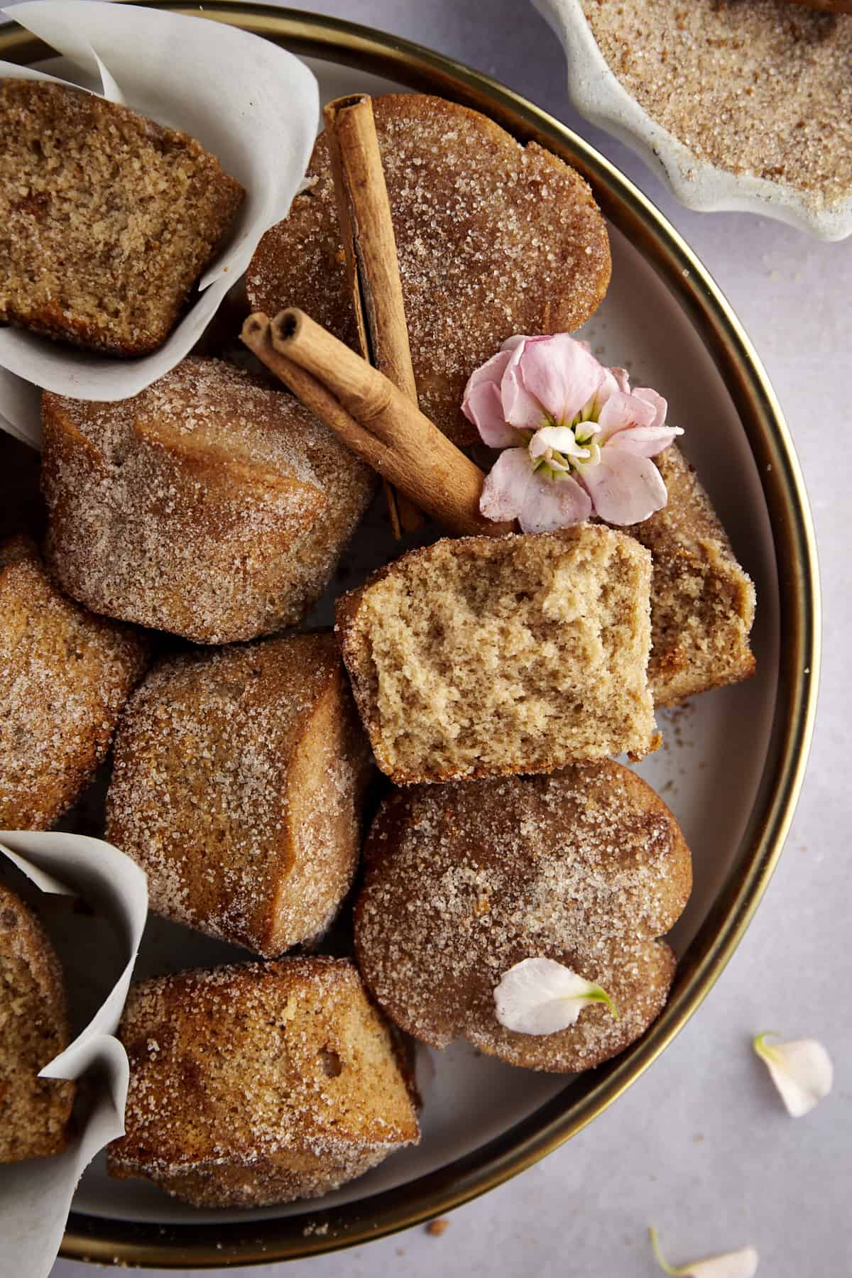A plate of baked apple cider muffins. 