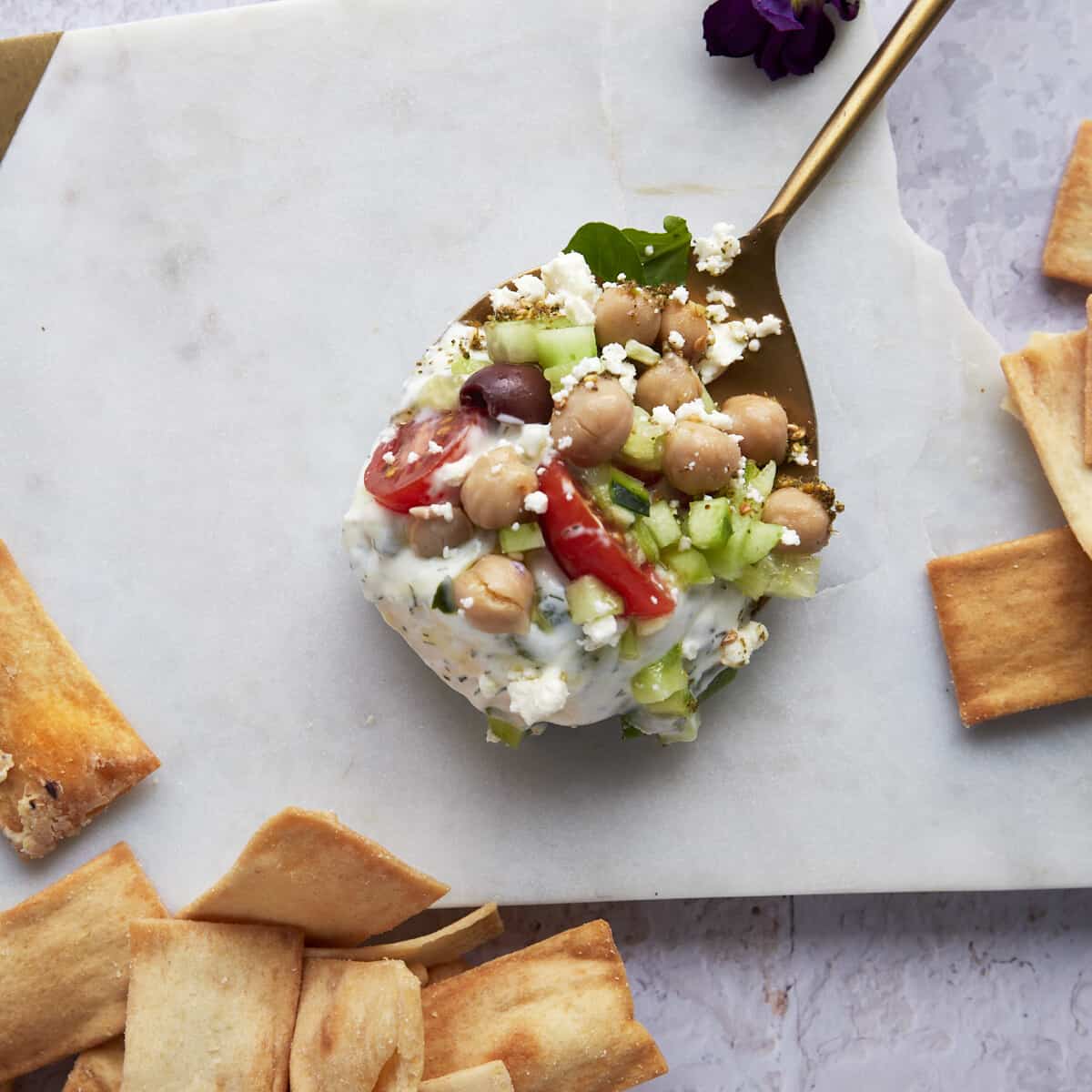 A spoonful of 7 layer Greek layer dip.